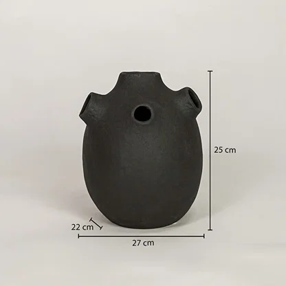Black ceramic vase measuring 25 cm height and 27 cm width for modern tabletop decor placement styling.