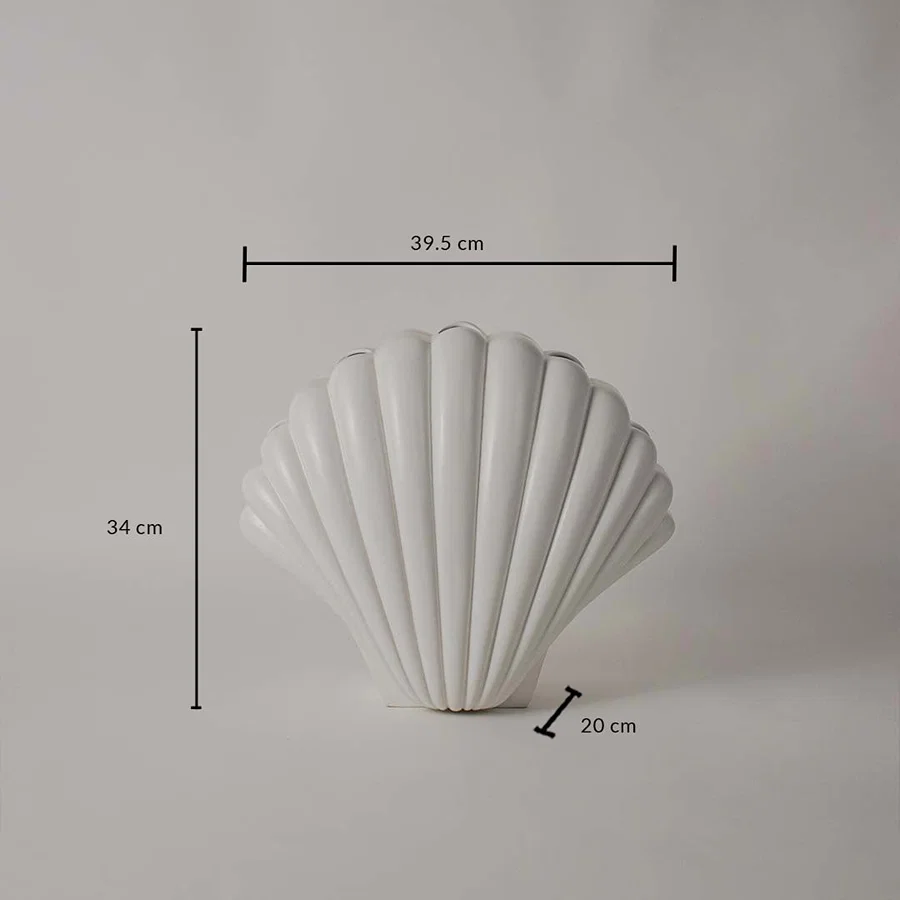 White shell decorative sculpture shown with 34 cm height 39.5 cm width and 20 cm depth offering a clear accurate size reference.