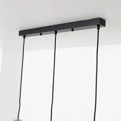 Black metal linear ceiling canopy with hanging cords highlighting premium finish and craftsmanship.
