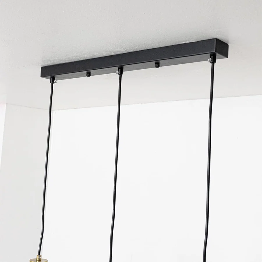 Black metal linear ceiling canopy with hanging cords highlighting premium finish and craftsmanship.