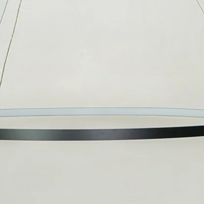 Contemporary sleek linear hanging light with black finish displayed against soft white ceiling background perfect for modern interior decor lighting.