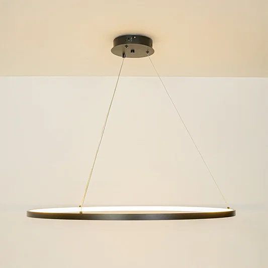 Contemporary slim linear pendant light with cable suspension hanging against clean white ceiling background ideal for modern home lighting.