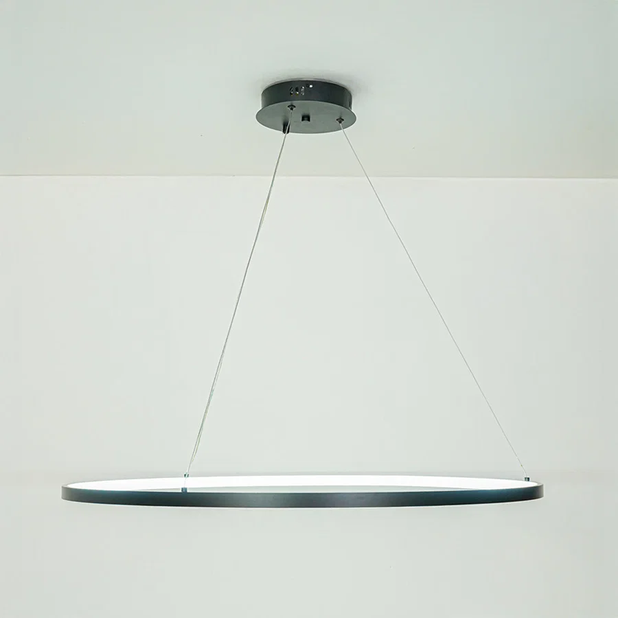Elegant modern linear pendant light with slim profile hanging against neutral ceiling background ideal for contemporary dining or kitchen lighting.

