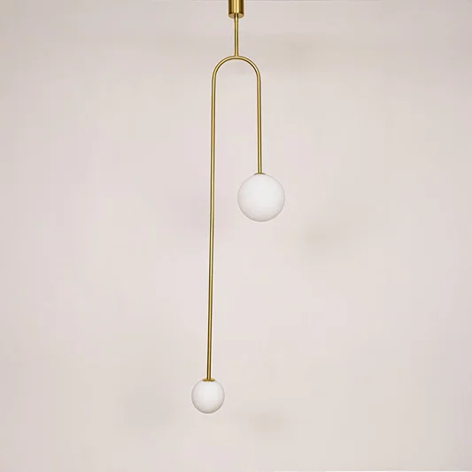 Gold metal pendant light with frosted globe glass shade designed for elegant modern ceiling lighting in homes.