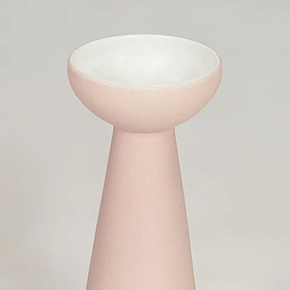 Pink ceramic flower vase closeup modern decorative tabletop vase for living room shelf console decor styling.