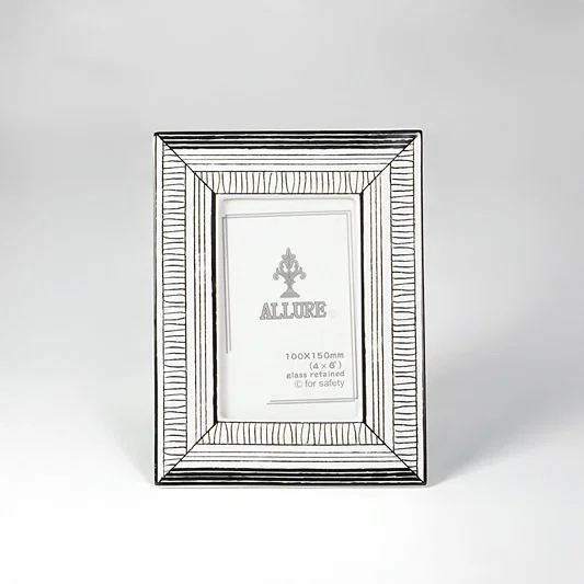 Silver textured photo frame for elegant tabletop placement and contemporary indoor home decor styling accent piece.