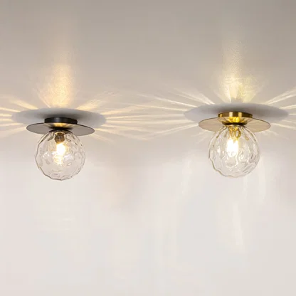 Black and gold ceiling lights with glowing textured glass globes displayed on white background for modern home lighting.