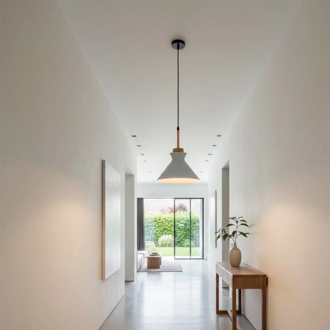 White metal pendant light in hallway adding Scandinavian elegance and warm ambient lighting to modern interiors.