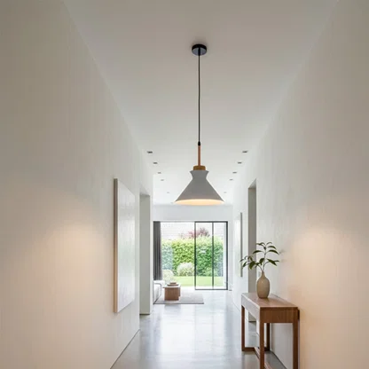 White metal pendant light in hallway adding Scandinavian elegance and warm ambient lighting to modern interiors.