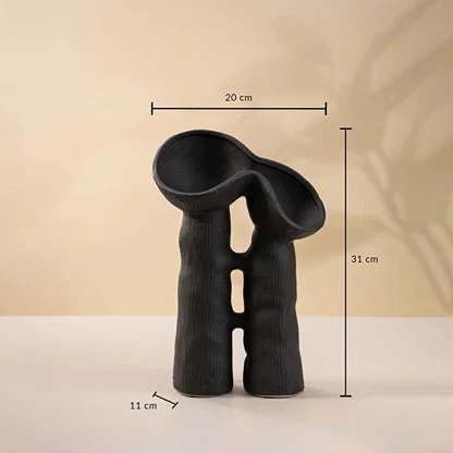Black modern sculptural ceramic vase with 31 cm height and 20 cm width shown with dimension markers.