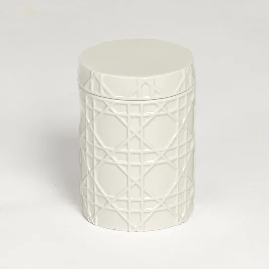 White ceramic decorative jar with embossed geometric pattern isolated on clean white background for elegant tabletop decor display.