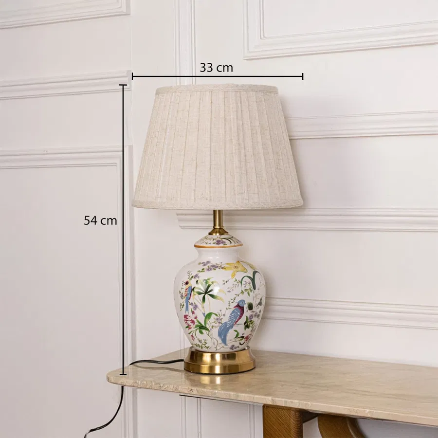 Designer ceramic table lamp measuring 54 cm in height and 33 cm in width featuring hand-painted details and a textured beige shade.