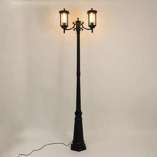 Vintage outdoor street lamp with dual glowing lanterns for elegant exterior decor styling use.