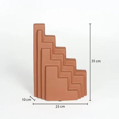 Orange ceramic stepped decorative sculpture measuring 35 cm height 25 cm width and 10 cm depth for modern shelf decor styling.