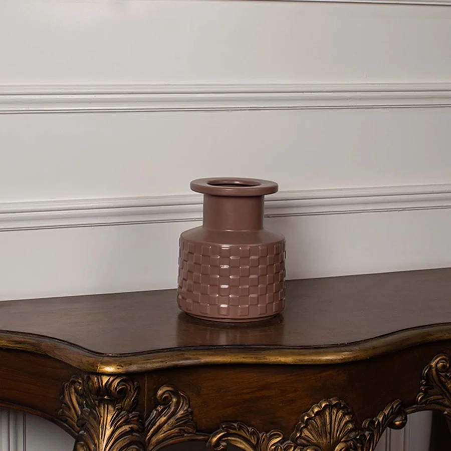 Terracotta textured ceramic vase with matte finish displayed on white background perfect for modern home styling.