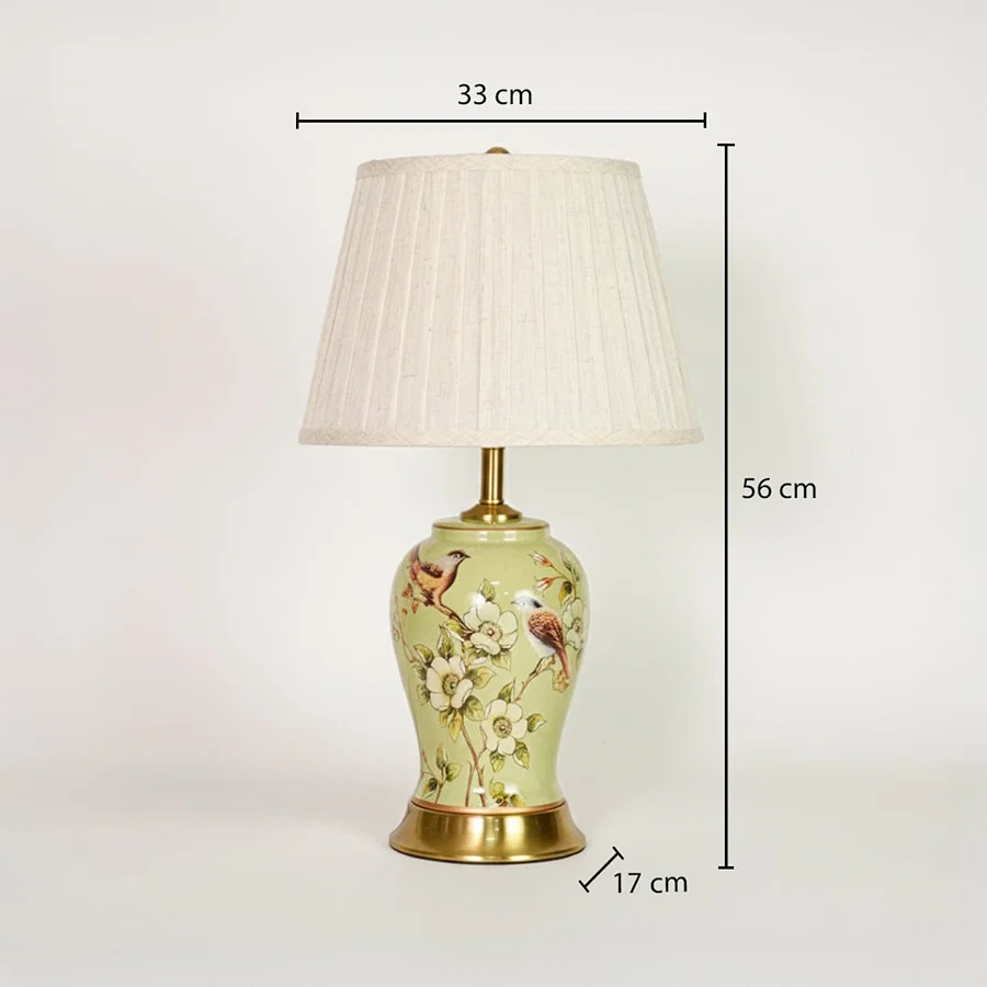 Green ceramic table lamp showing 56 cm height 33 cm shade width and 17 cm base size ideal for bedside placement.