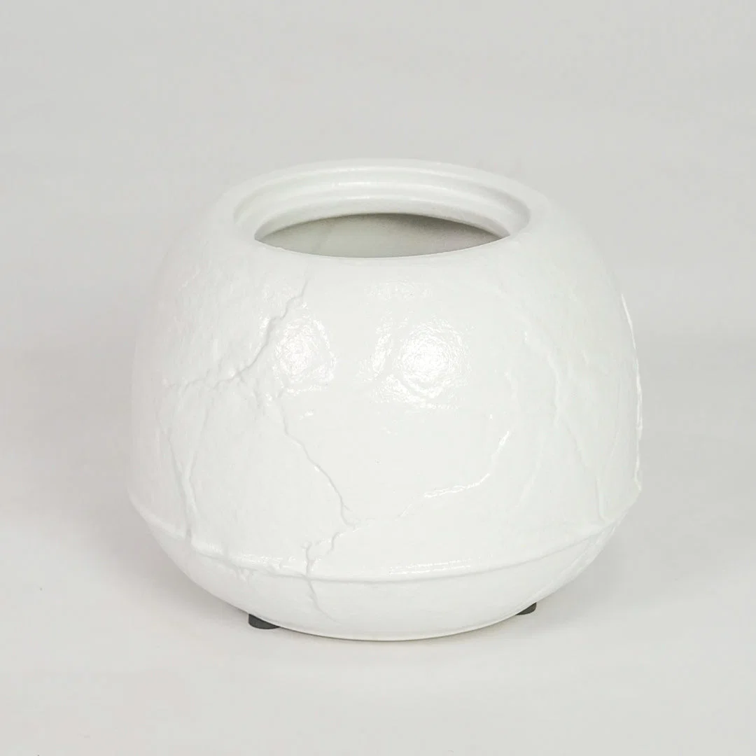 White ceramic planter pot for modern console table placement and stylish indoor decor styling accent display piece.