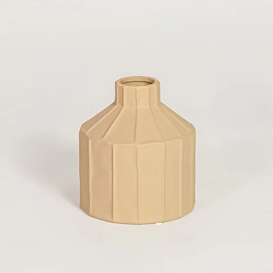 Contemporary beige ceramic flower vase with geometric silhouette perfect for entryway table living room decor display.
