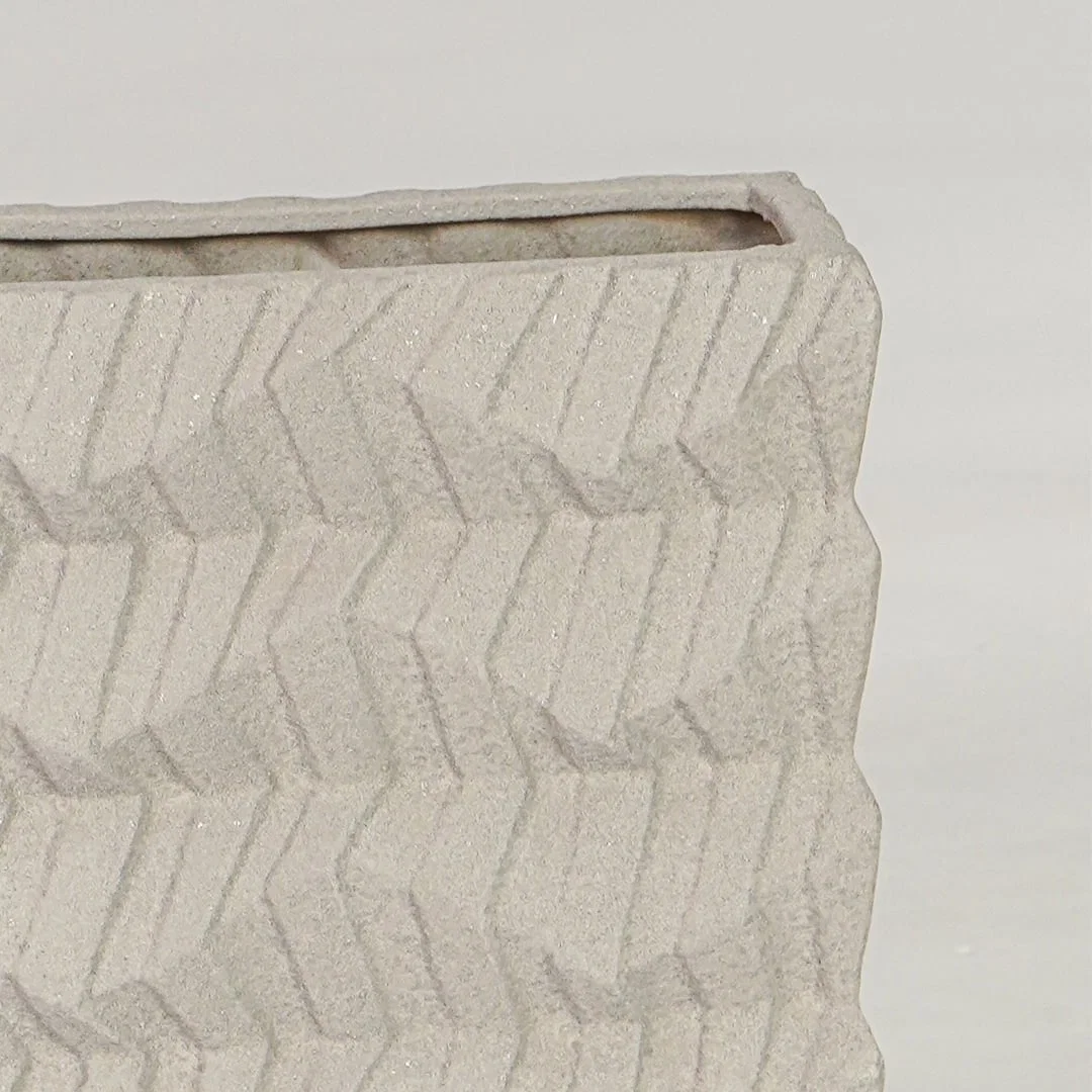 Beige ceramic decorative vase closeup with textured finish modern flower vase for shelf console styling.
