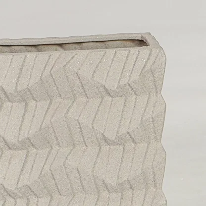 Beige ceramic decorative vase closeup with textured finish modern flower vase for shelf console styling.
