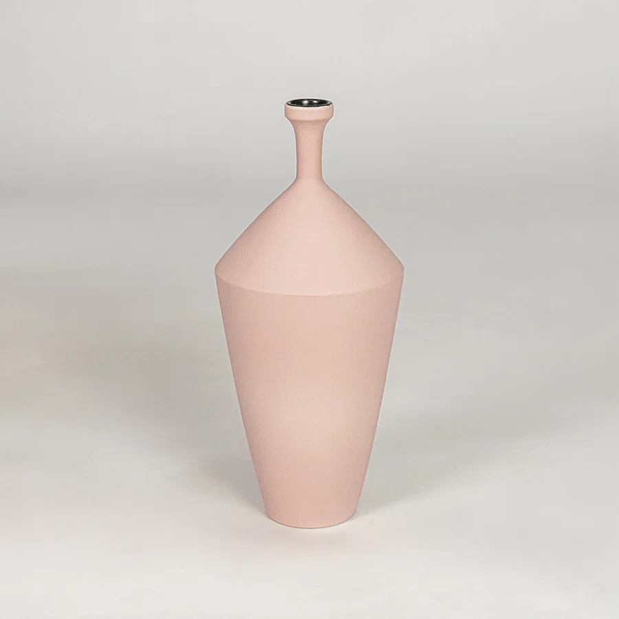 Tall slender matte pastel pink vase for chic modern home decor and refined elegant tabletop accent styling needs.