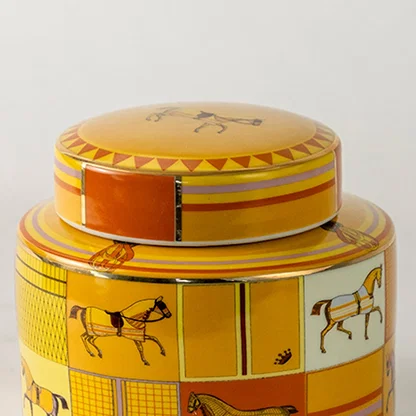 Yellow ceramic jar with horse artwork in a close up view ideal for bright décor styling and decorative tabletop accents.