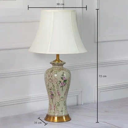 Ceramic table lamp with floral artwork shown with 72 cm height and 38 cm width measurements for home decor styling.