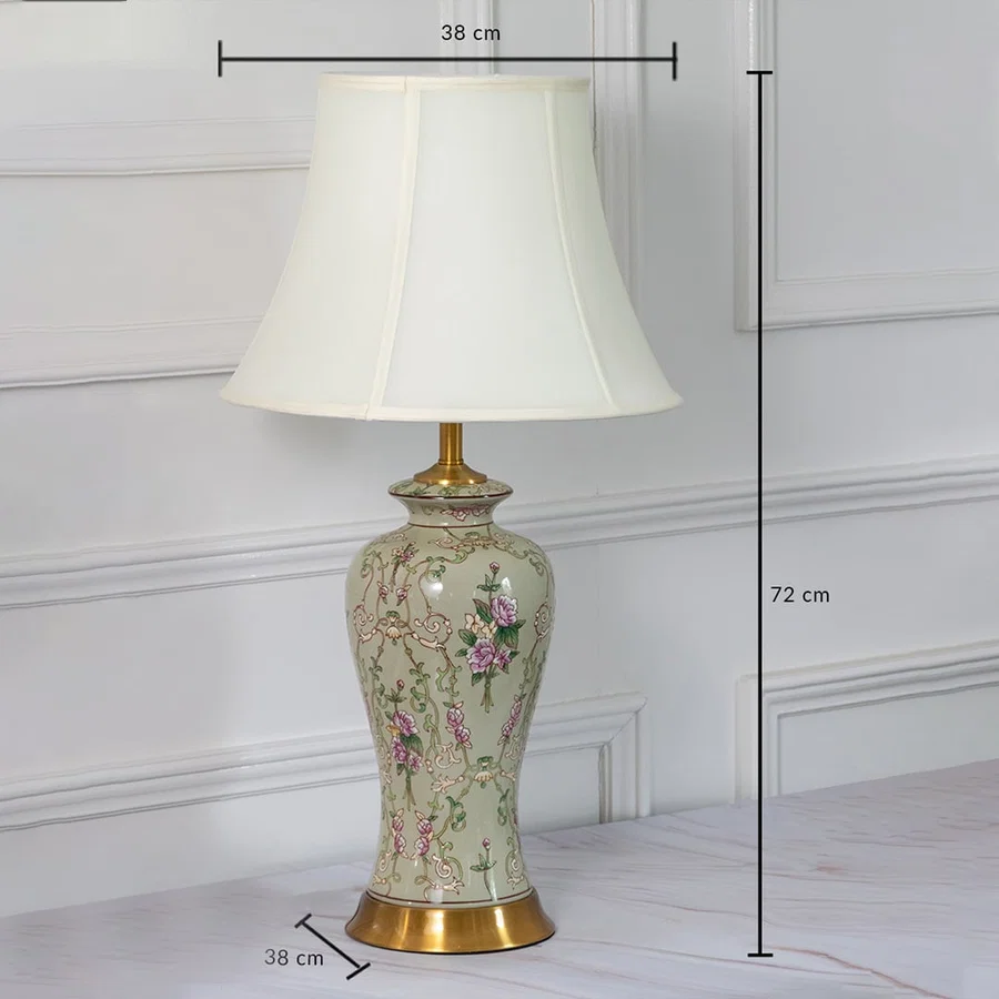 Ceramic table lamp with floral artwork shown with 72 cm height and 38 cm width measurements for home decor styling.