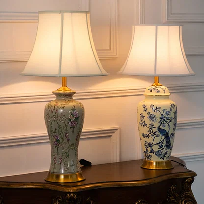 Floral ceramic table lamps with fabric shades styled on a wooden console table adding elegant traditional decor lighting.