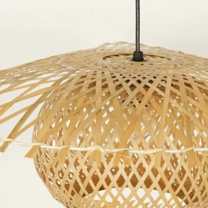Closeup of handwoven bamboo pendant light with natural finish showcasing intricate craftsmanship.
