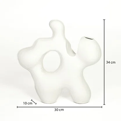 Dimension image of abstract matte white ceramic cutout sculpture vase with fluid curvy frame showing 34 cm height and 30 cm width.