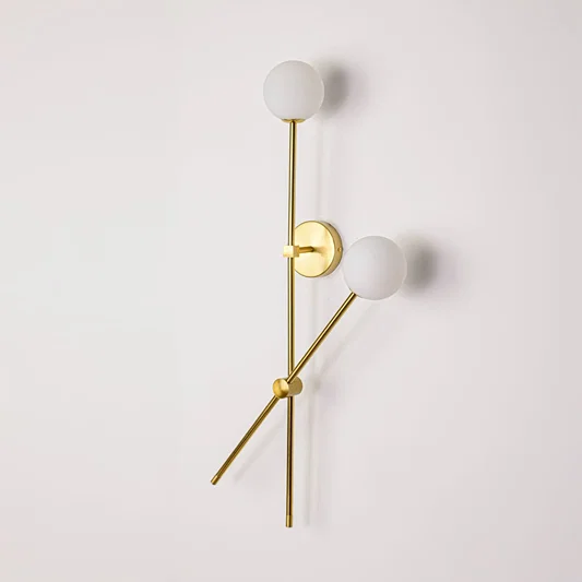 Wall light turned off on white background showcasing clean metal lines frosted glass globes and minimalist vertical design.