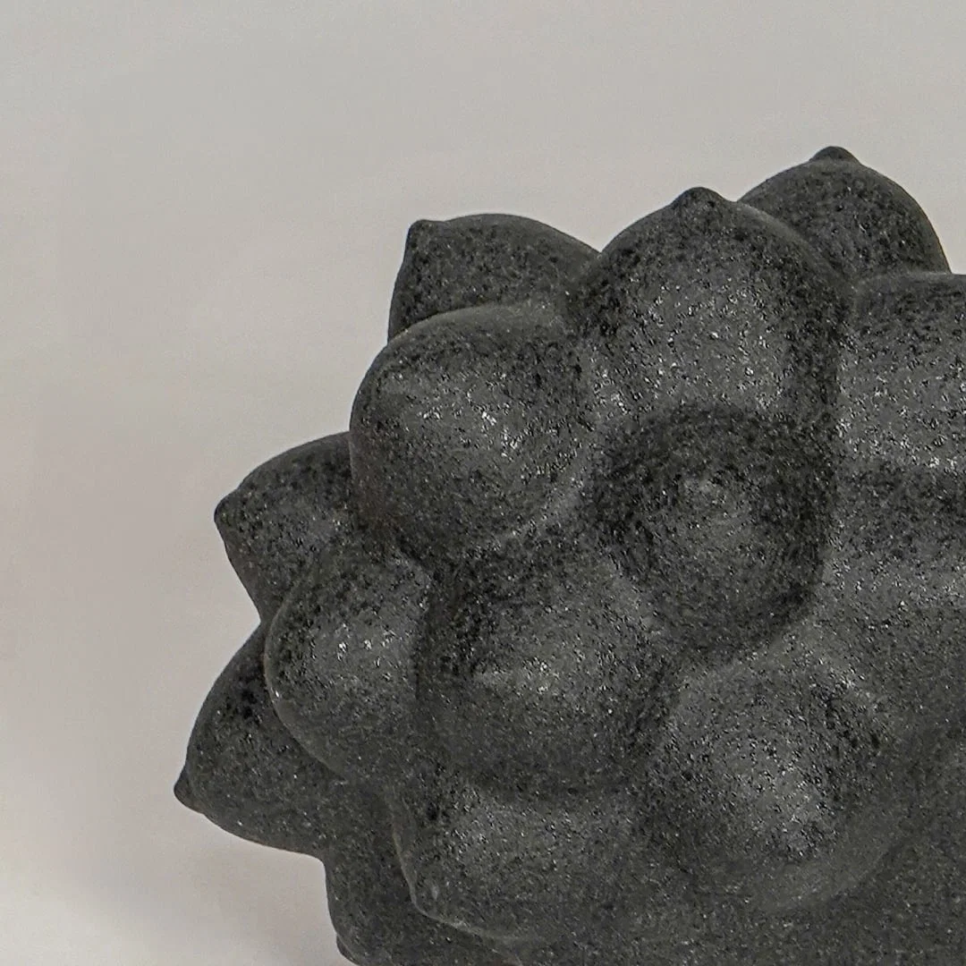 Black ceramic decor sculpture closeup with textured pattern modern showpiece for table console decor styling.