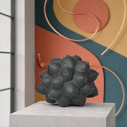 Black ceramic decor sculpture placed on table modern decorative showpiece for living room console styling.