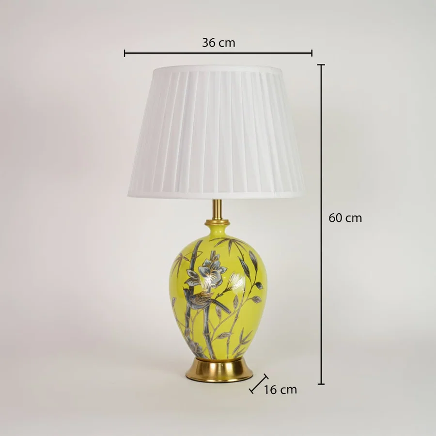 Yellow ceramic table lamp showing 60 cm height 36 cm shade width and 16 cm base size suitable for bedside placement.