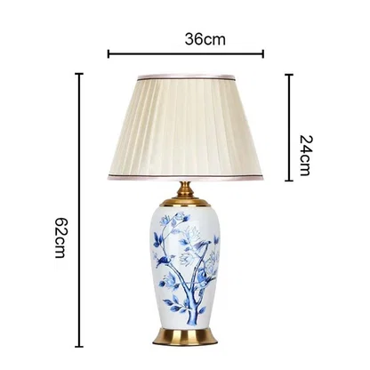 Designer ceramic and metal table lamp measuring 62 cm in height and 36 cm in width with a 24 cm shade perfect for adding timeless charm to interiors.