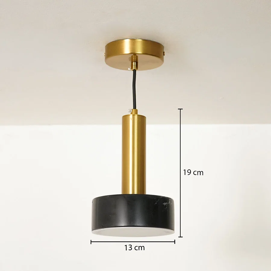 A modern pendant light fixture with a gold cylindrical body, a black circular shade, and a gold ceiling canopy, shown with dimension lines indicating 19 cm height and 13 cm width.
