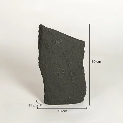 Dimension image of rustic wabi sabi textured dark charcoal black stone vase with slanted opening showing 30 cm height and 18 cm width.