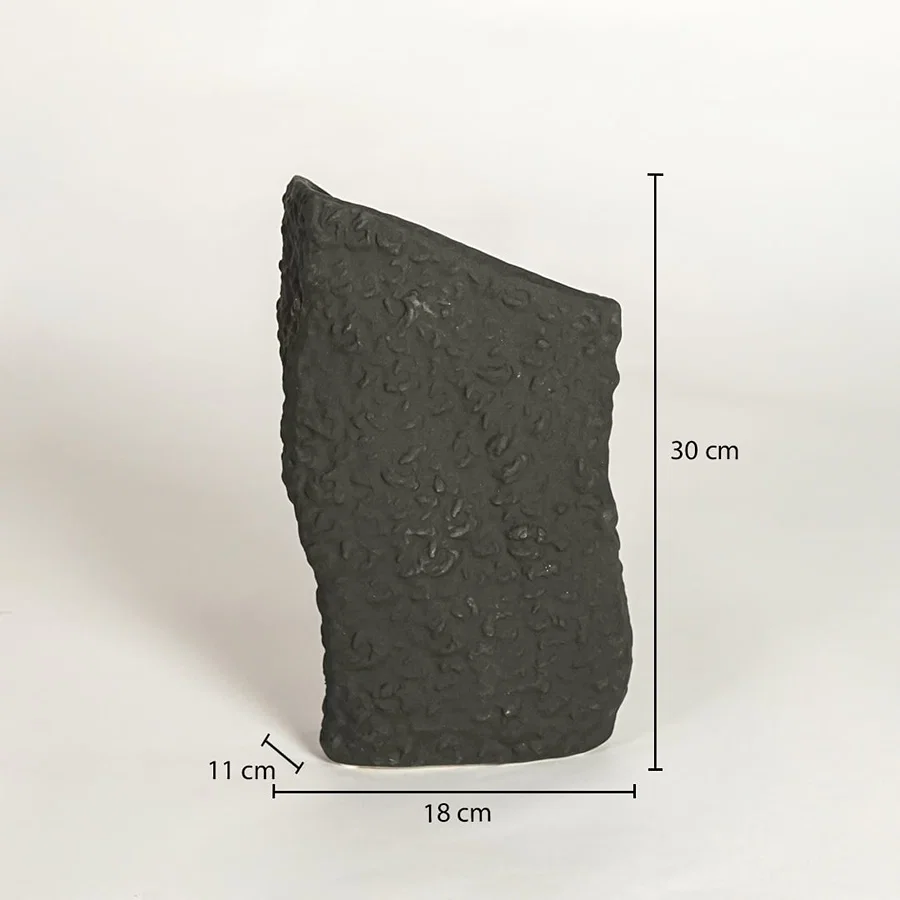 Dimension image of rustic wabi sabi textured dark charcoal black stone vase with slanted opening showing 30 cm height and 18 cm width.