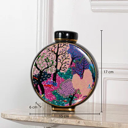 Decorative ceramic jar measuring 17 cm height 15 cm width and 6 cm base depth suitable for tabletop decor placement.