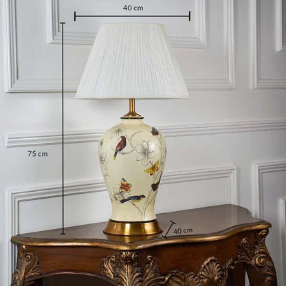 Ceramic table lamp with bird and floral motifs shown with 75 cm height and 40 cm shade dimensions for interiors.