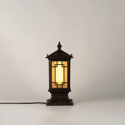 Vintage black outdoor gate light with glowing glass panels for luxury exterior decor styling use.