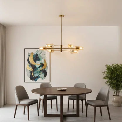 Modern dining room styled with gold linear chandelier above wooden table creating warm ambient lighting and refined contemporary Decor.