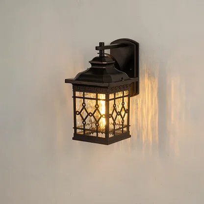 Modern black rectangular outdoor wall lantern on white background with geometric lattice water glass shade for patio.