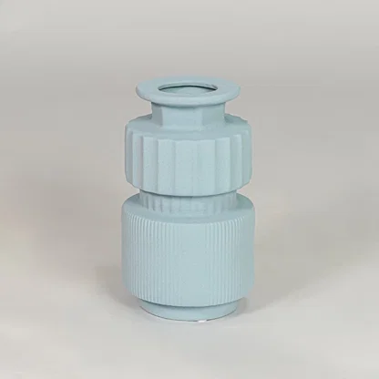 Light blue ceramic decorative vase isolated on white background modern flower vase for living room table decor styling.