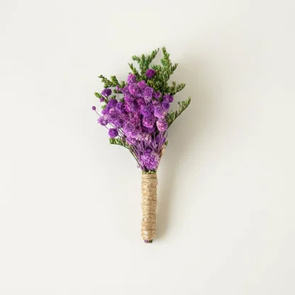 Dried floral stem bouquet with rich purple blossoms and green foliage on white background highlighting natural texture handcrafted charm and elegant decor styling appeal.