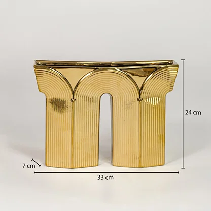Gold metal decorative sculpture size 24 cm height 33 cm width 7 cm depth modern showpiece for console table styling.