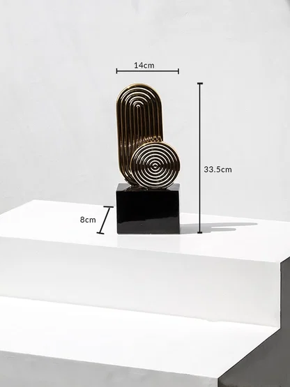 Gold metal decorative sculpture with black base showing height 33.5cm width 14cm base 8cm for table decor.