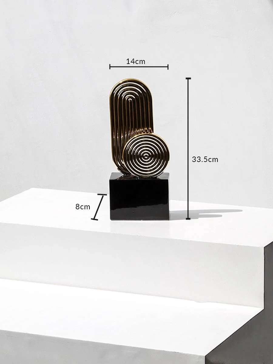 Gold metal decorative sculpture with black base showing height 33.5cm width 14cm base 8cm for table decor.