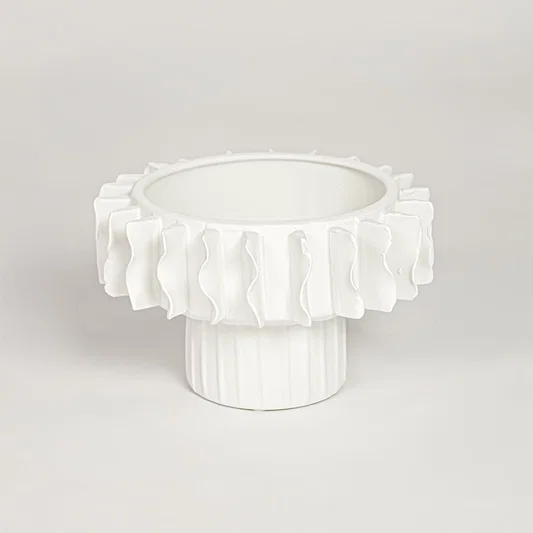 White ceramic frilled small vase with layered sculpted rim isolated on clean white background for elegant decor styling.